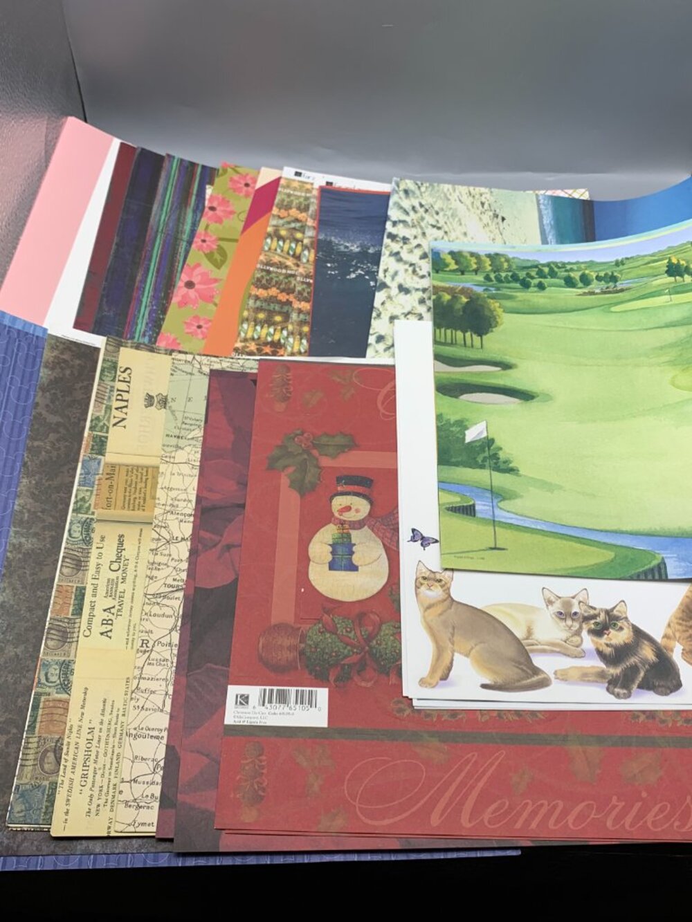Assortment of Scrapbook Paper in Various Themes sizes 12"x12" and 8.5"x11"